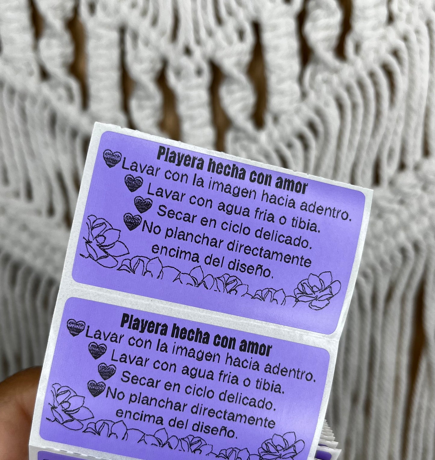 Paquete de 100 stickers con instrucciones de cuidado para playeras